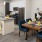 a kitchen with a dining table and chairs